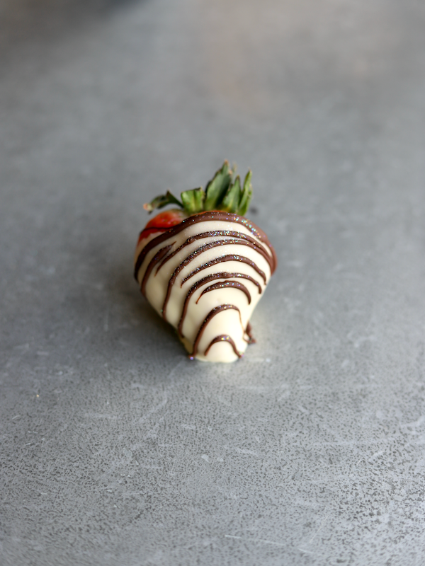 White Chocolate covered Strawberry with Chocolate Stripes
